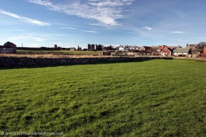 View to village and Lindisfarne Priory.